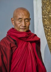 serene monk at Khamsum Yulley Namgyal Chorten